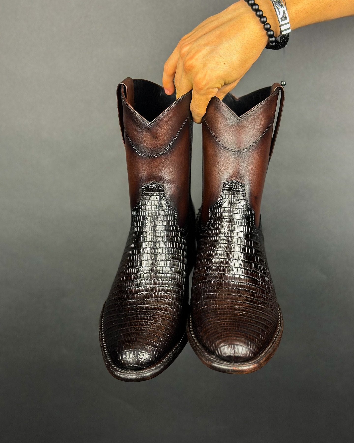 Black and brown textured denim boots