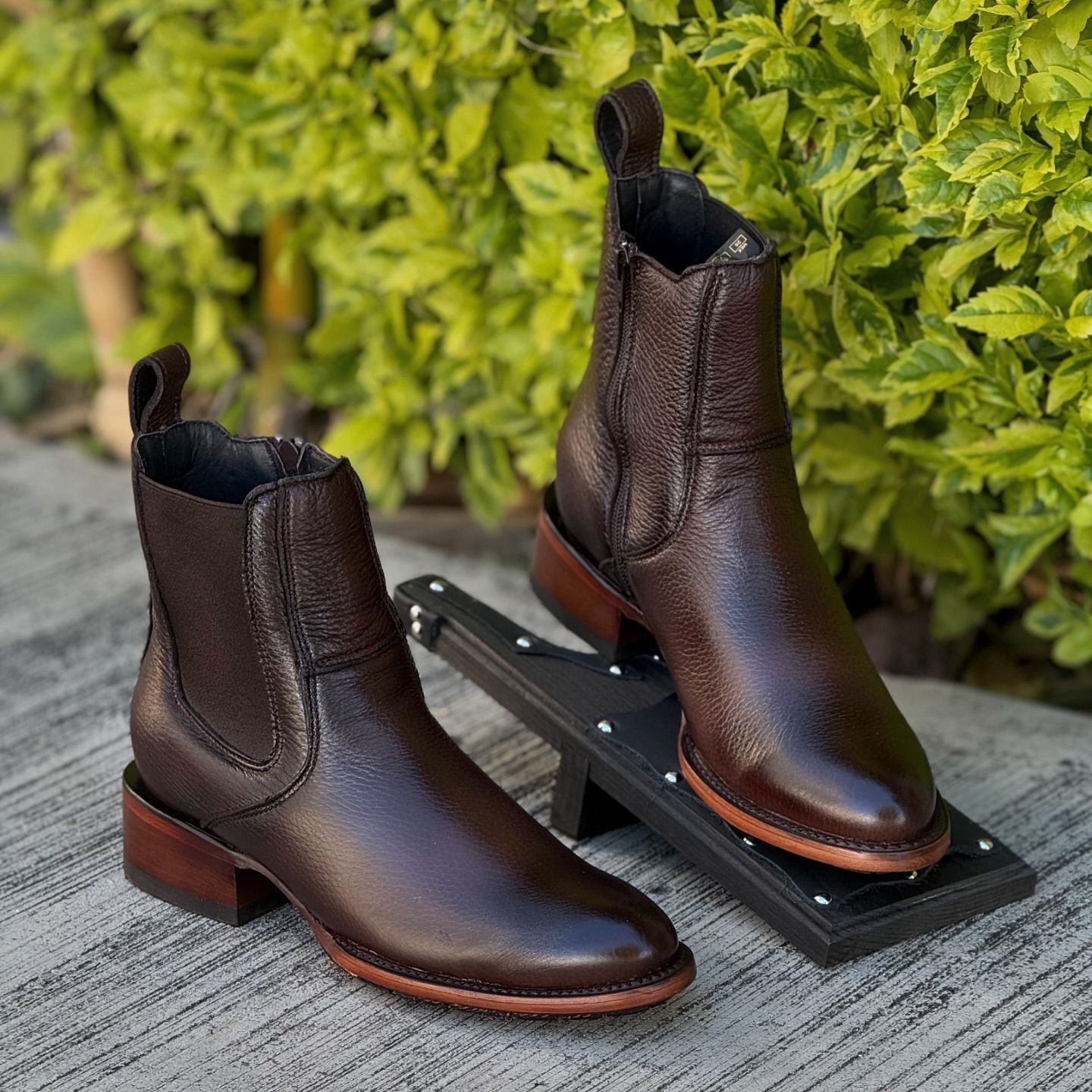 Black and brown reinforced sole casual leather boots