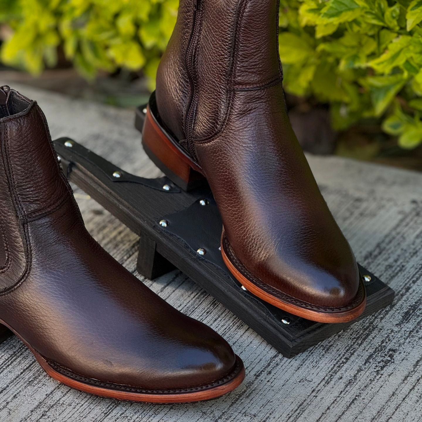 Black and brown reinforced sole casual leather boots