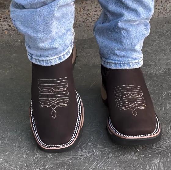 White embroidered brown denim boots