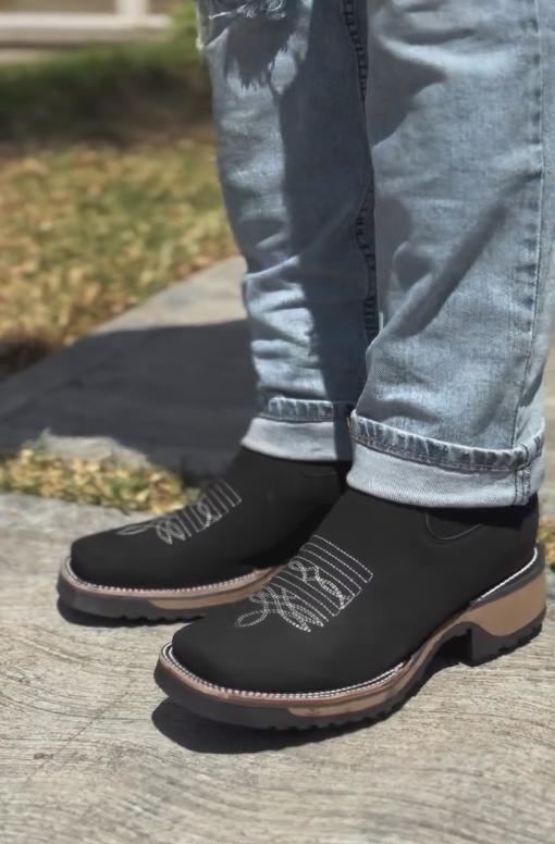 Black embroidered platform leather sports boots