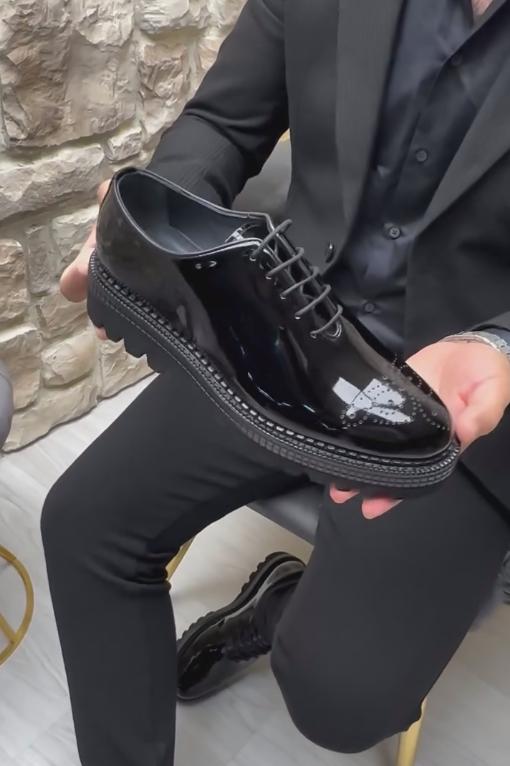 Shiny black perforated Italian leather soft-soled shoes